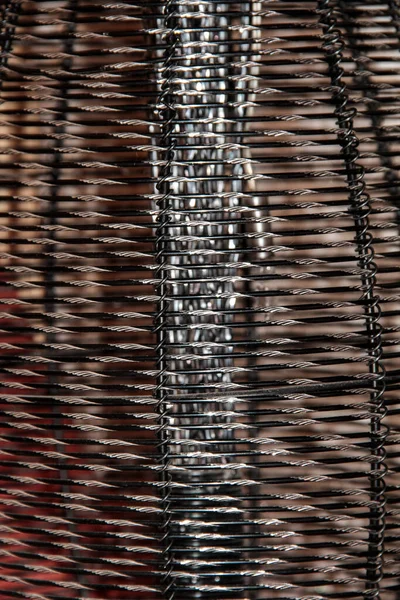 Texture of an iron mesh with a diamond cut.
