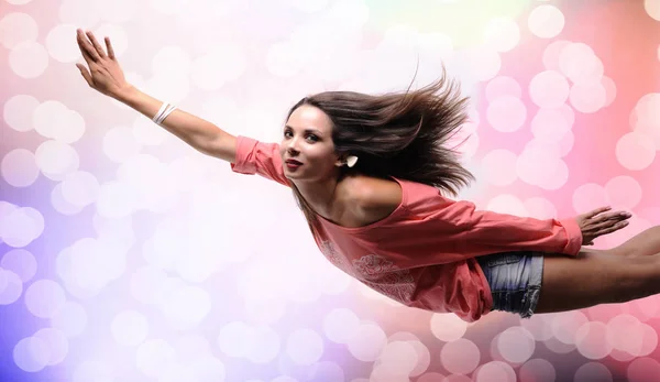 Beautiful woman flying on a abstract background