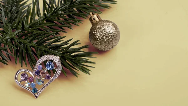 Brooch with multi-colored crystals on a branch tree .New Year's still-life — Stock Photo, Image