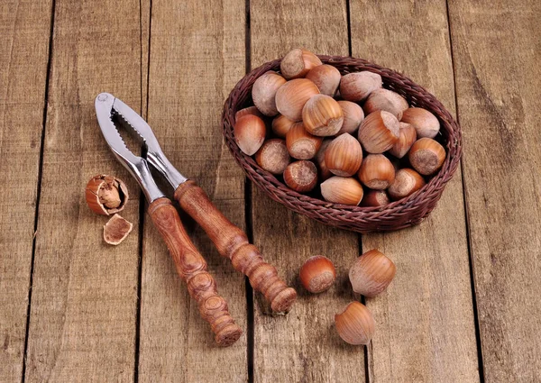 Different types of nuts on wooden background — Stock Photo, Image