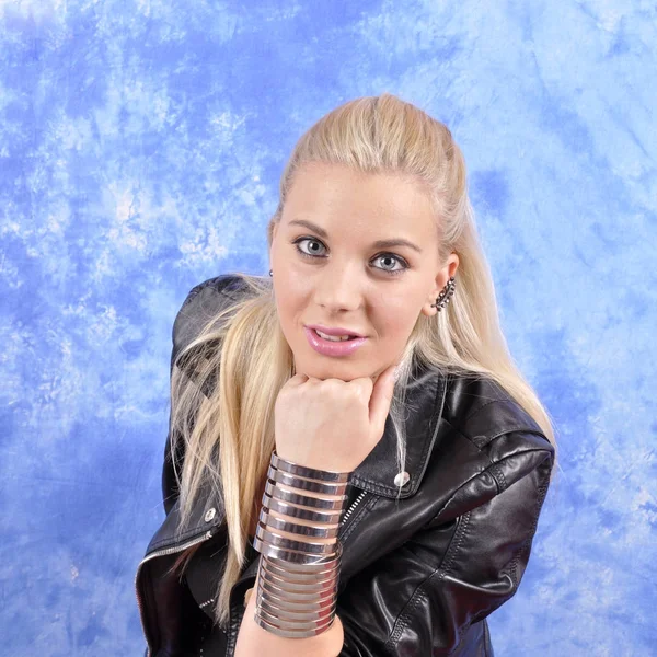 Young beautiful woman in a leather jacket on her arm wide bracel — Stock Photo, Image