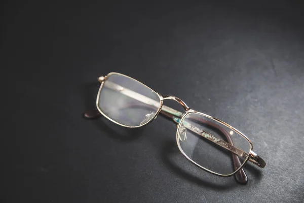 Optical glasses on black table background — Stock Photo, Image