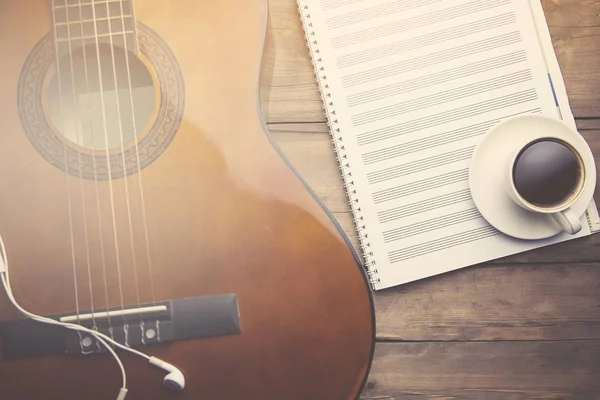 notebook, guitar and coffee