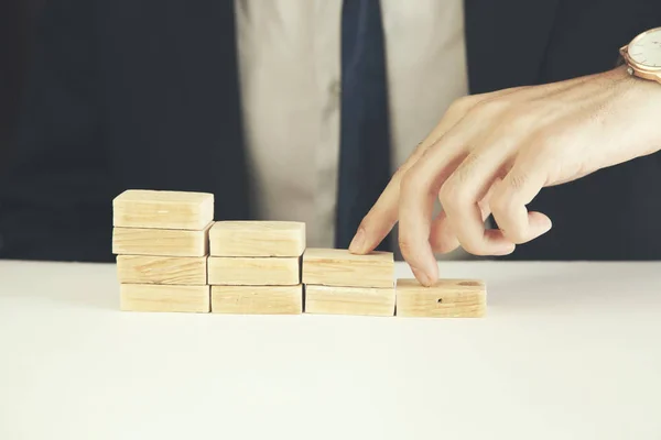 Man hand and wooden blocks — Stock Photo, Image