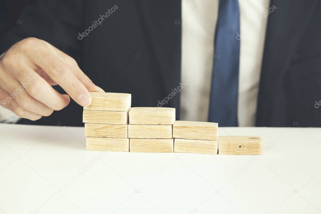 man hand  wooden blocks