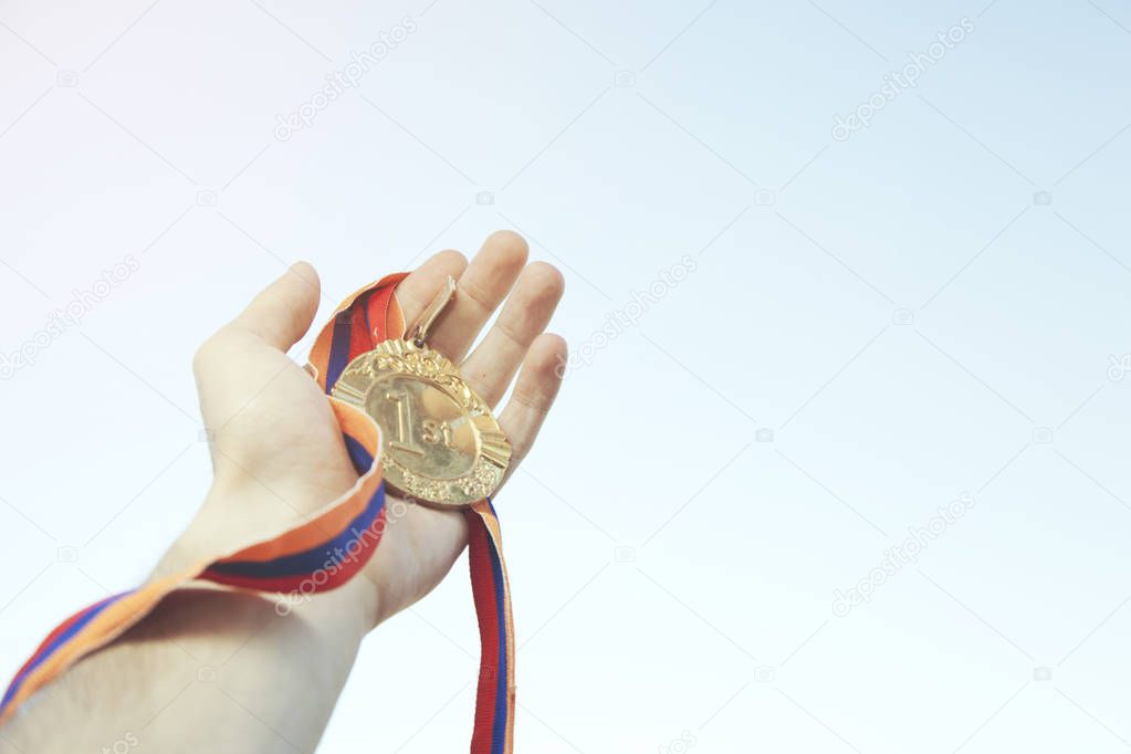 man hand medal