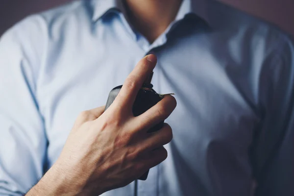 Businessman using perfume — Stock Photo, Image