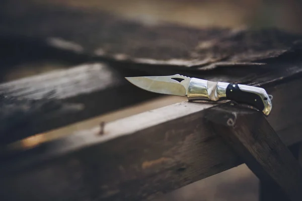 Knife on wood — Stock Photo, Image