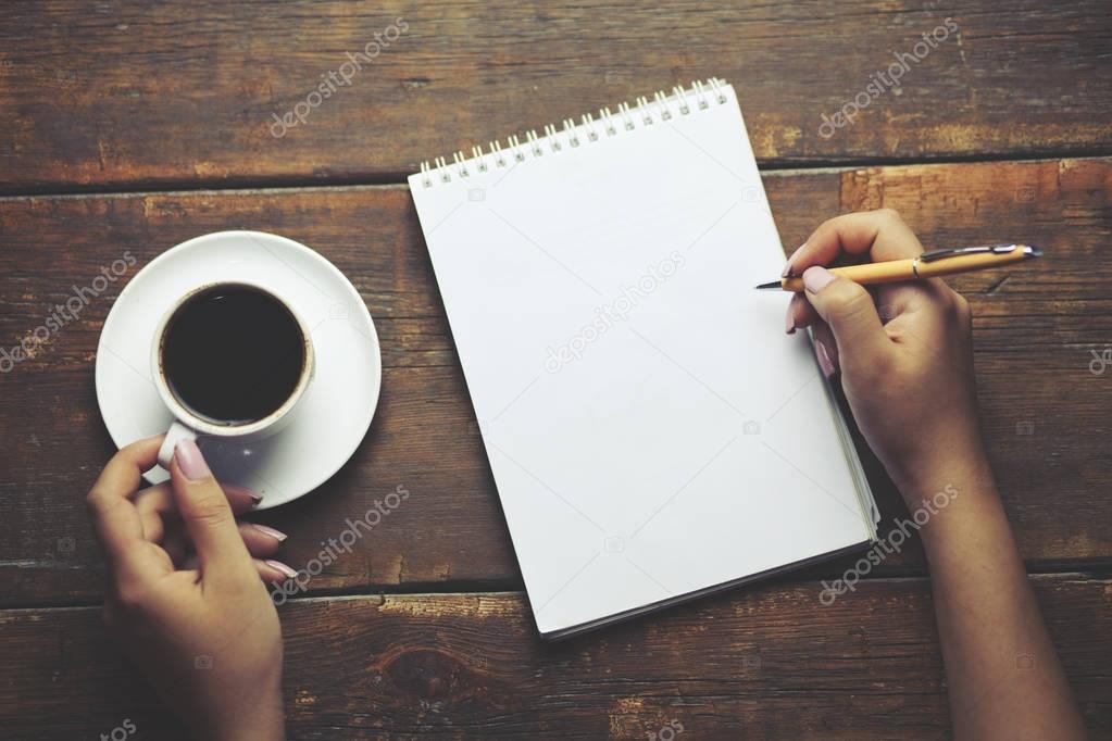 woman hand pen and coffee