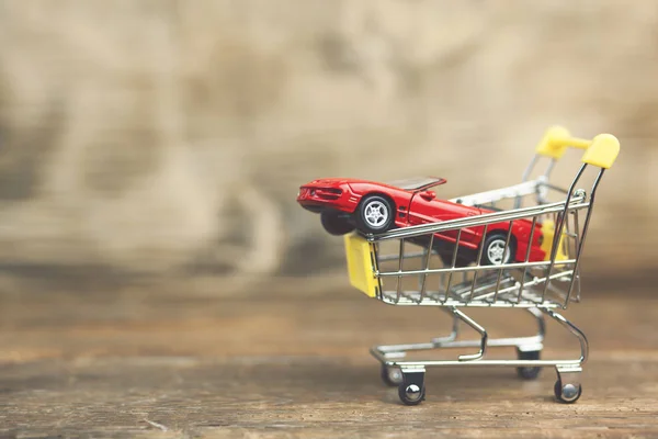 Car on shopping cart — Stock Photo, Image
