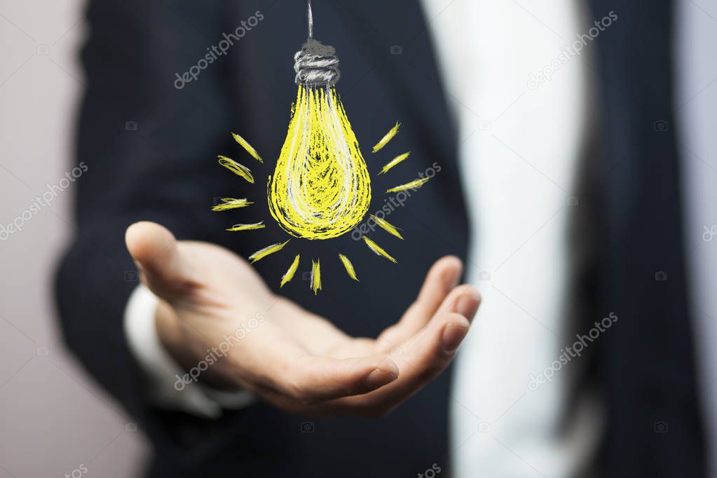 bulb over  hand, Business idea