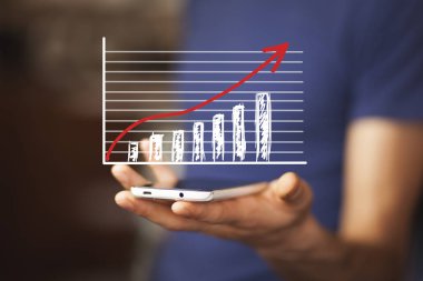 işadamı ile telefon üzerinde grafik.