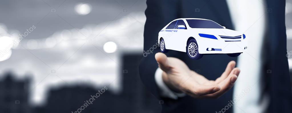 man's hand with  car above, close up