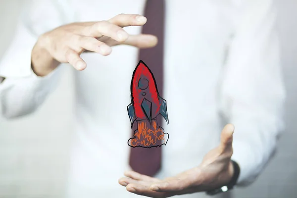赤いロケットのアイコンを持つ実業家 コンセプト — ストック写真