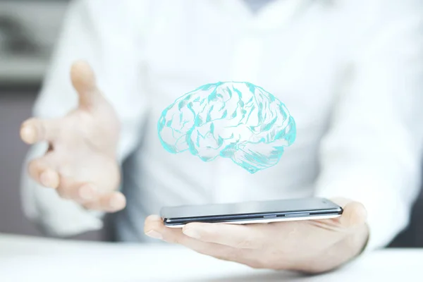 Hombre mano teléfono con cerebro — Foto de Stock