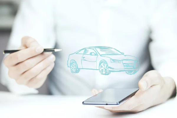 Man  holding phone with car icon — Stock Photo, Image