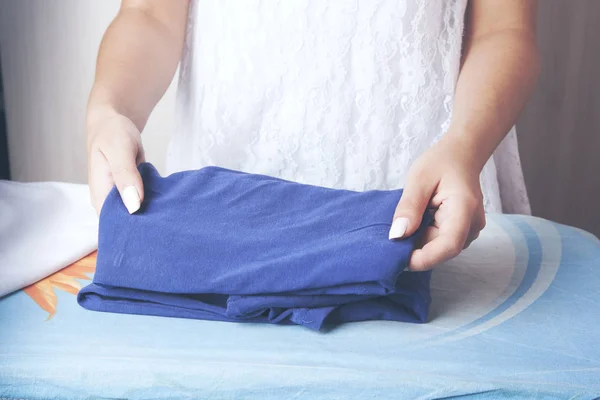 Housewife is folding colorful towels in closeup — 스톡 사진