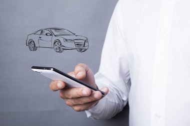 Ekranda arabası olan bir erkek cep telefonu..