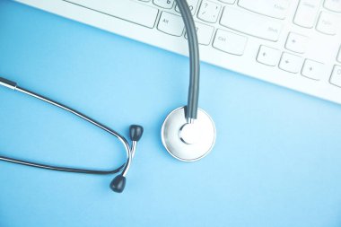 stethoscope on the computer keyboard with copy space