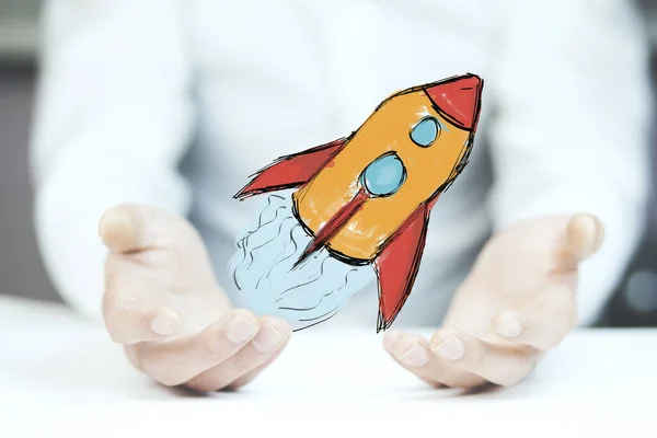 Üzletember kézi vörös rakéta — Stock Fotó