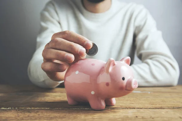 Man Putting Coin Piggy Bank Saving Money Concept — Stock Photo, Image