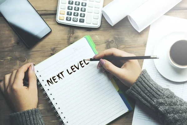 Woman Written Next Level Text Notepad Stationary Table — Stock Photo, Image