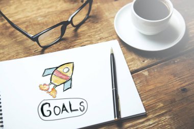 golas kahve eşliğinde not defterine mesaj atıyor.