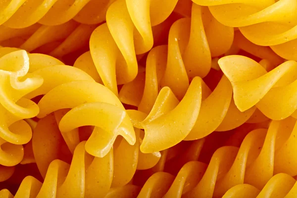Ιταλική Fusilli closeup ζυμαρικά τροφίμων υφή φόντου — Φωτογραφία Αρχείου
