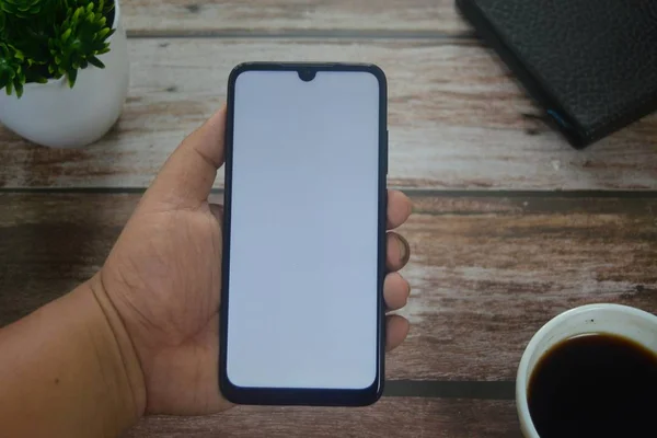 Close Hands Blank Screen Smartphone Wooden Table — Stock Photo, Image