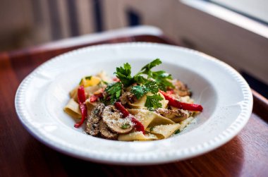 Special Italian Pasta with vegetables mushroom, parsley, red paper and parmesan
