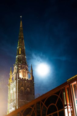 Gothic view of Coventry Cathedral with moon light, Midlands, UK