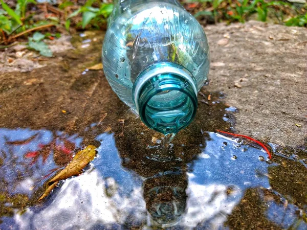 Water bottle spilled on the floor. environment concept