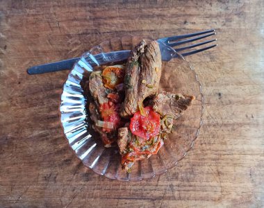 Stewed meat on wooden board. typical food of Guatemala clipart