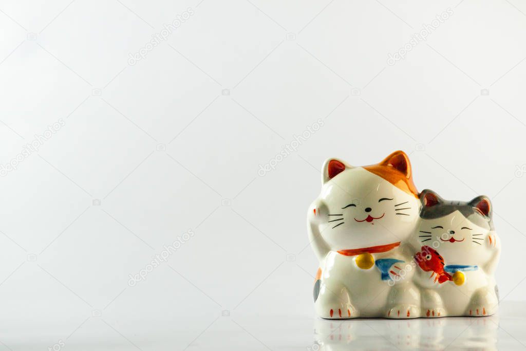 cat beck lucky wealth money fortunes maneki neko on white background