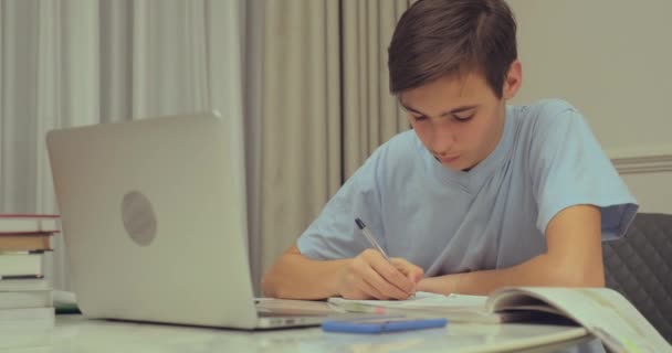 Teen Boy Doing School Lessons Home Student Writes Homework Child — Stock Video