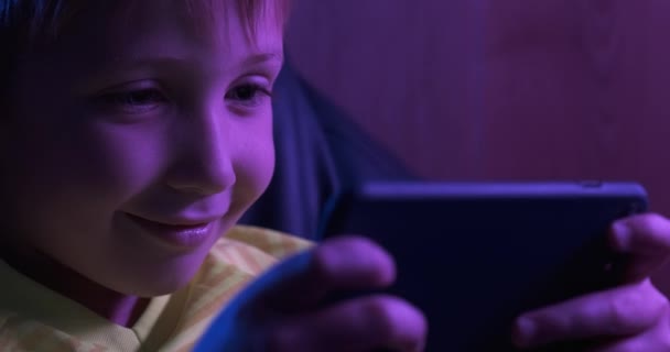 Boy Plays Games Evening Gamer Playing Game Using Smartphone Little — ストック動画