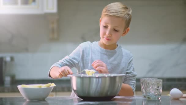 Child Cooking Kitchen White Boy Takes Spoon Butter Put Bowl — Stock Video