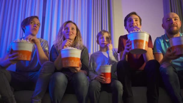 Happy Family Watches Movie Eats Popcorn Young Family Children Watching — Stock Video