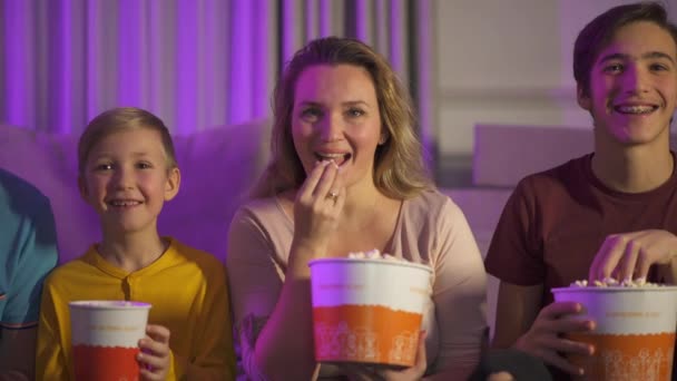 Happy Family Watches Movie Eats Popcorn Young Family Children Watching — Stock Video
