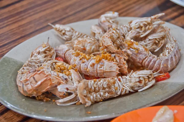 Spicy garlic dried stir fried mantis rock lobster with sea salt in Hong Kong cuisine style
