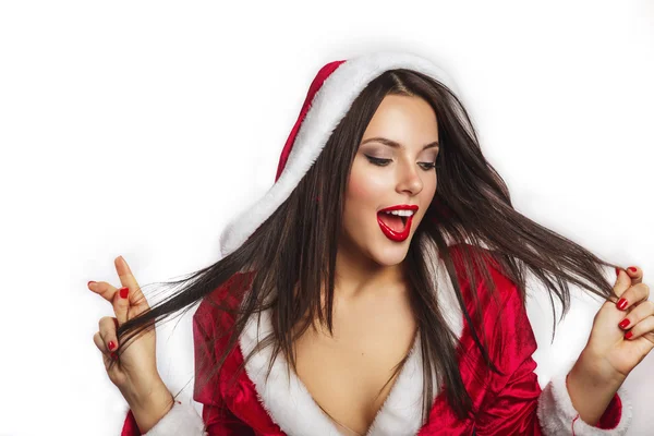 크리스마스 산타 모자 여자 초상화는 크리스마스 선물을 잡아. 파란색 배경에 웃는 행복 한 소녀. 산타 클로스 옷을 입고 아름 다운 섹시 한 여자의 초상화. — 스톡 사진