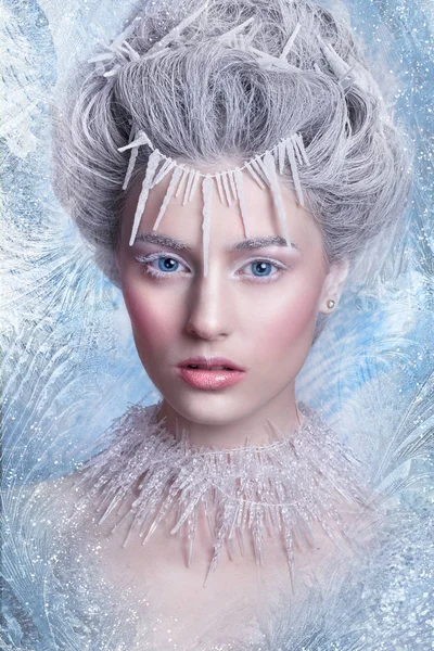 Snow Queen.Fantasy girl portrait. Winter fairy portrait.Young woman  with creative silver artistic make-up. Winter Portrait. Royalty Free Stock Images