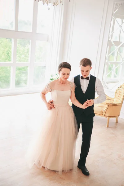 first wedding dance.wedding couple dances on the studio. Wedding day. Happy young bride and groom on their wedding day. Wedding couple - new family.