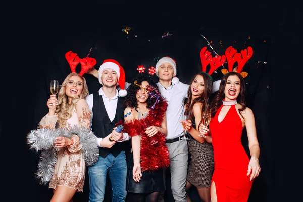 Friends celebrating Christmas or New Year eve party. — Stock Photo, Image