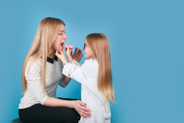 Adorable Child Dressed Doctor Playing Mother Indoor Blue Background — Stock Photo, Image