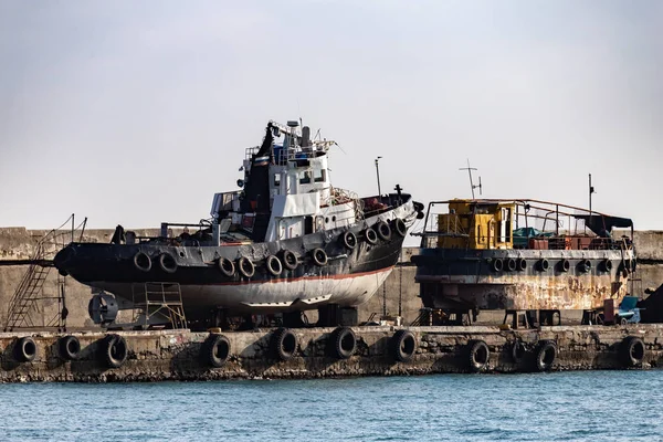 Old ships on the dock in the city of Yalta.