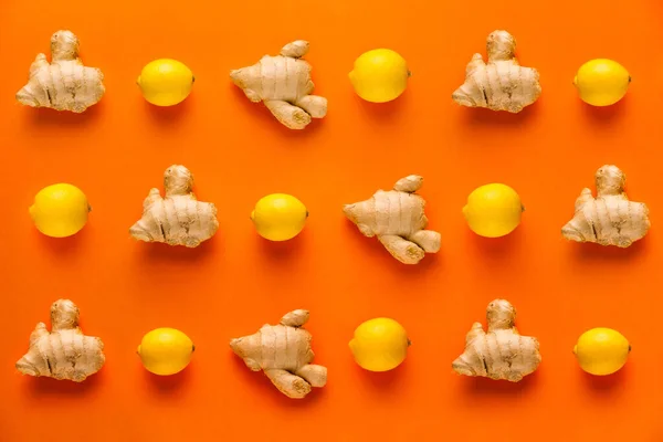 turuncu arka planda limon ve zencefil vitamin deseni