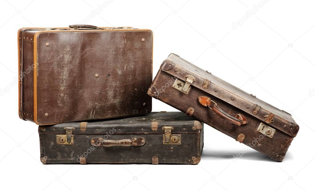 Old suitcases isolated on white background