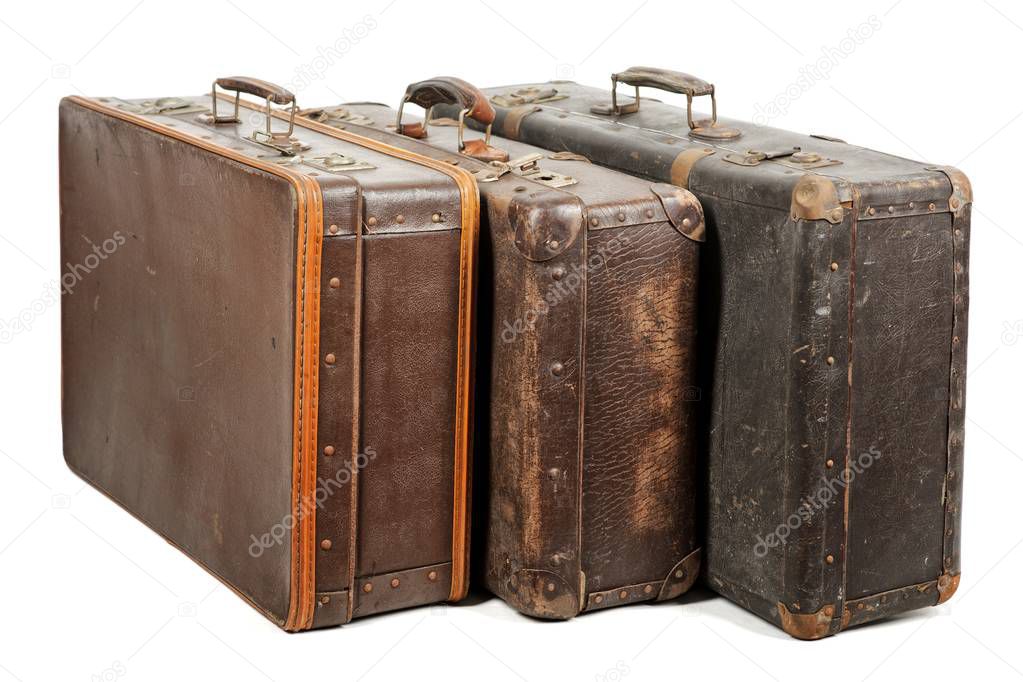 Old suitcases isolated on white background