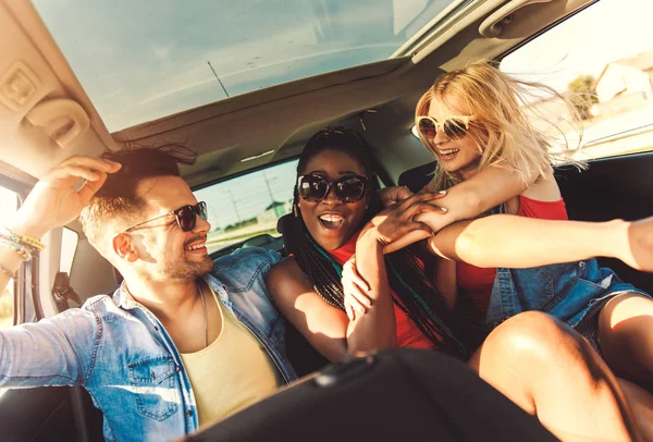 Friends travelling together by car